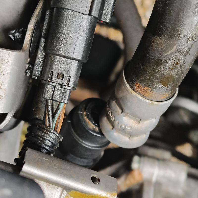 Heater hose fitting and clamp with wiring harness Heater hose fitting and clamp with wiring harness