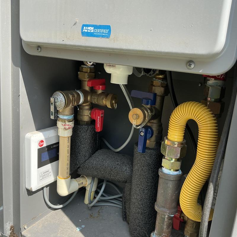 Tankless water heater outdoor unit piping and valves