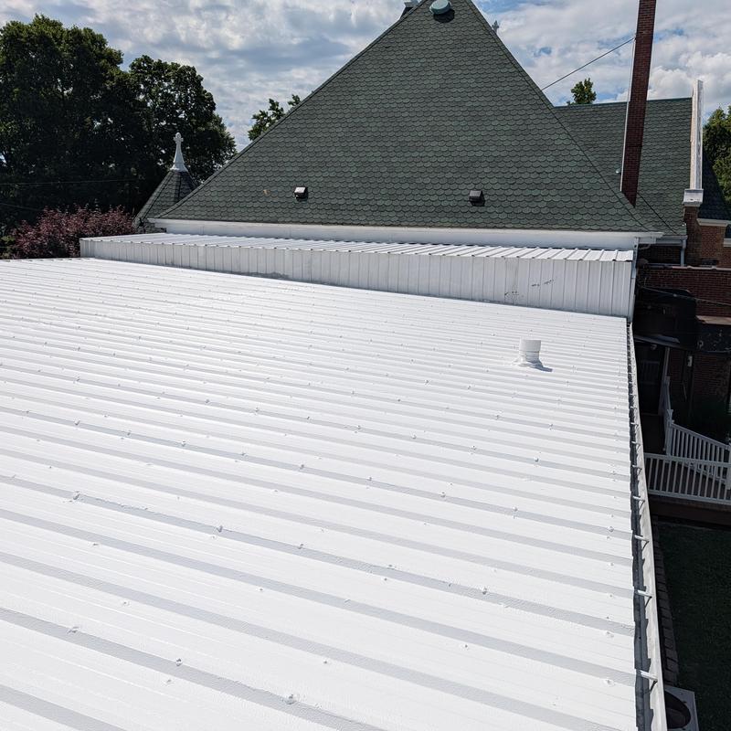 Commercial white metal roof with vent pipe