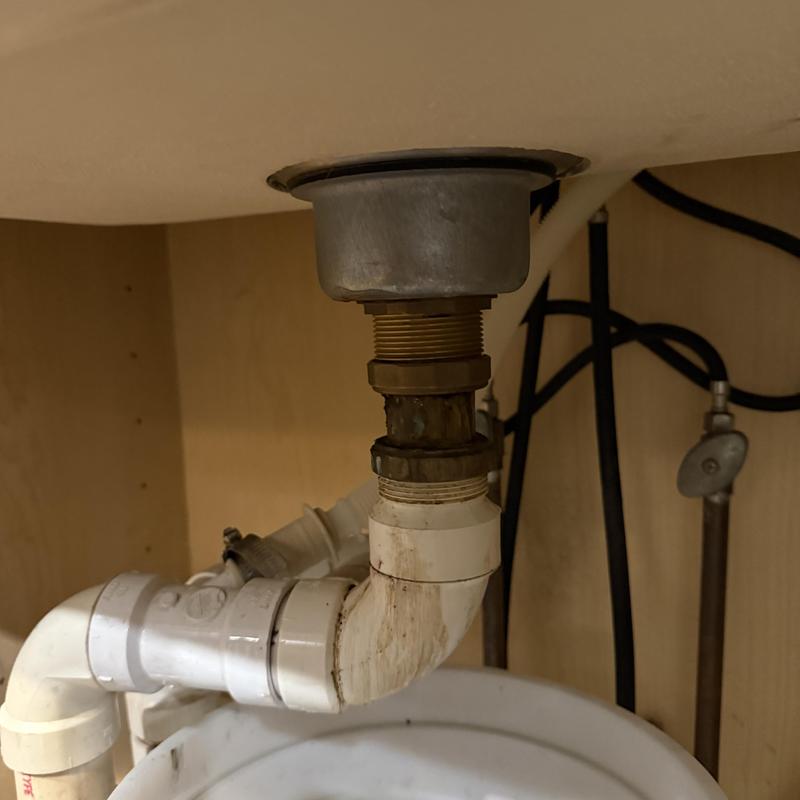 Kitchen sink drain pipe with new metal drain fitting Kitchen sink drain pipe with new metal drain fitting