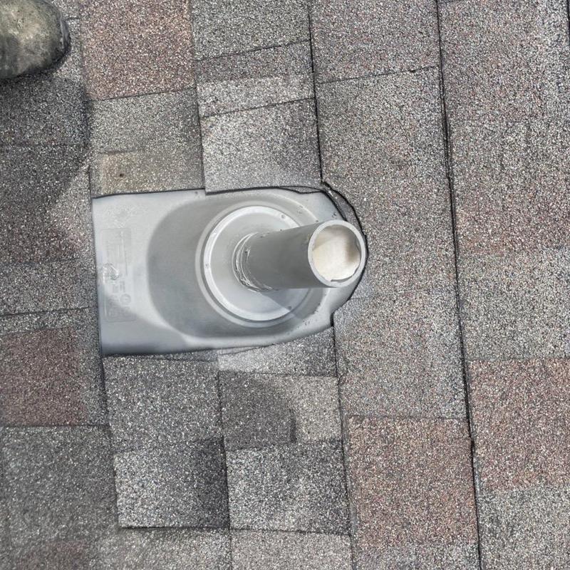 Roof vent flashing with new shingles installation