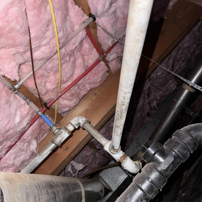 Galvanized water piping with valves in attic space Galvanized water piping with valves in attic space