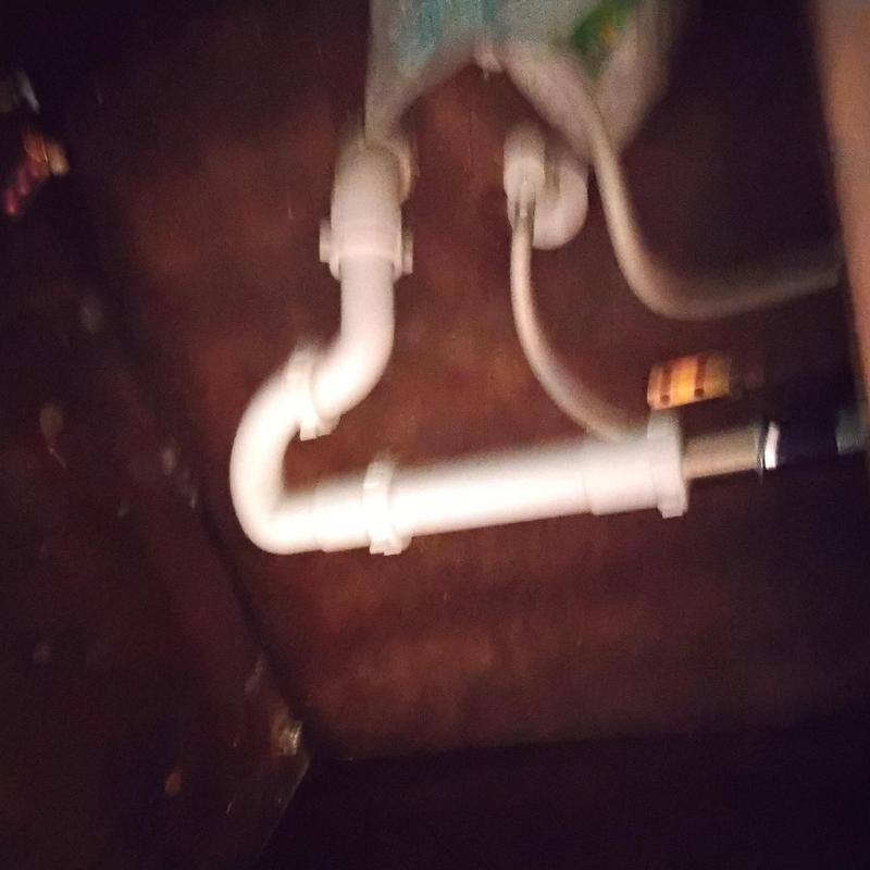 Jack and Jill lavatory sink drain pipes under cabinet