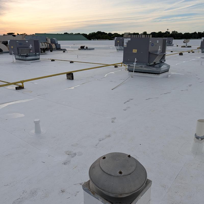 TPO single ply flat commercial roof with HVAC units
