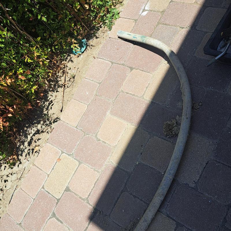 Underground water main pipe removed on brick driveway Underground water main pipe removed on brick driveway