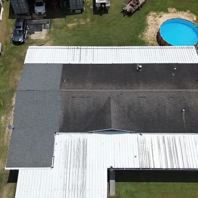 Asphalt shingle roof replacement with white metal sections