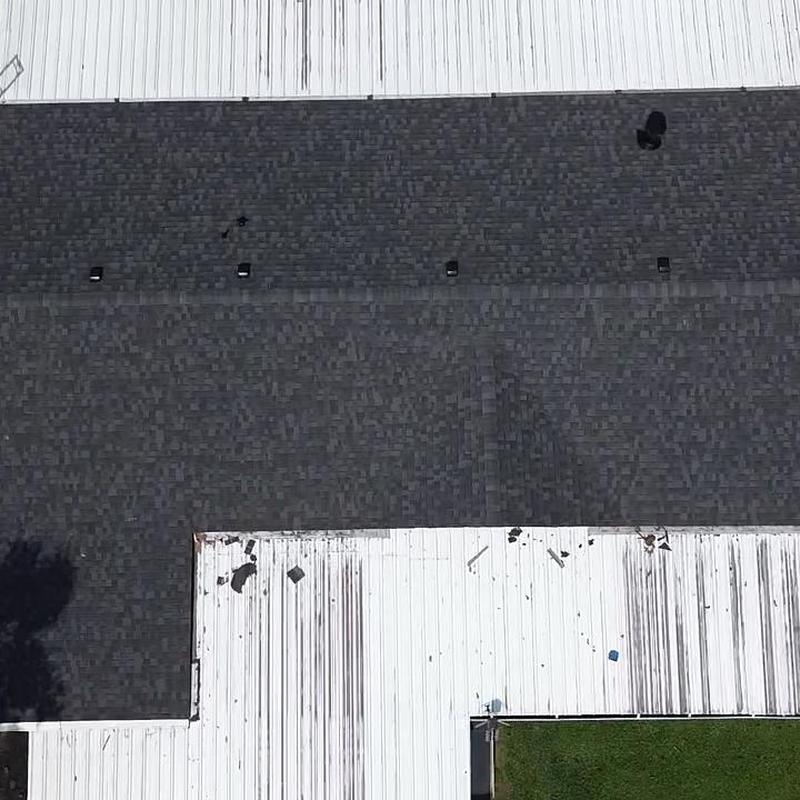 Asphalt shingle roof installation on metal building