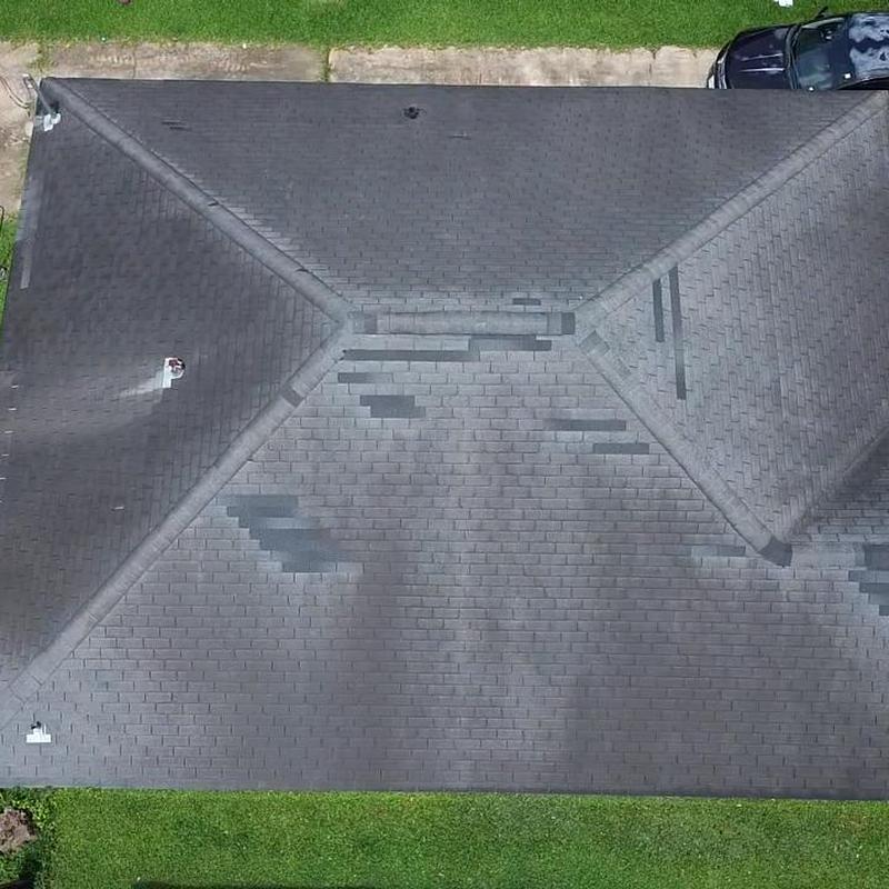 Asphalt shingle roof with damage patches in Baytown TX