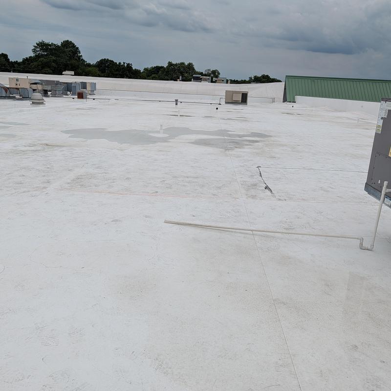 TPO single ply flat commercial roof with HVAC units