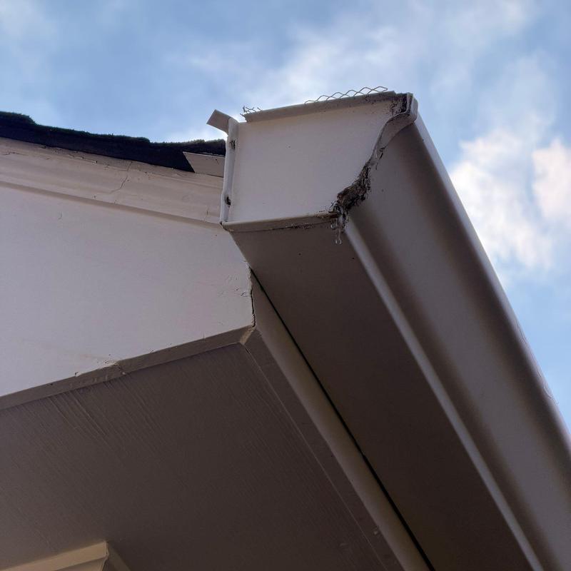 Gutter corner with dirt and minor damage close-up
