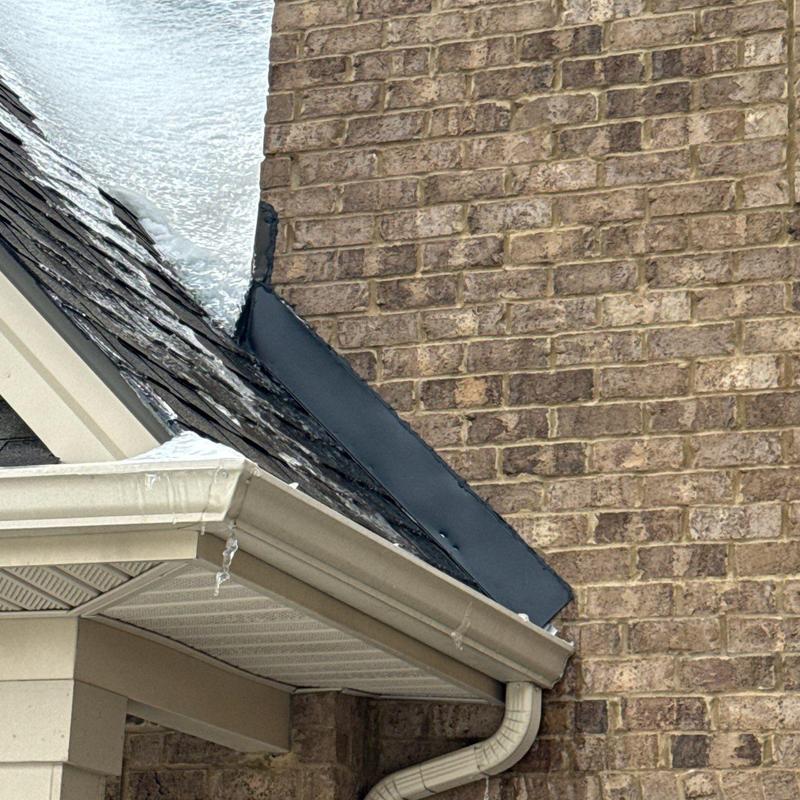 Roof flashing with hail damage and shingles