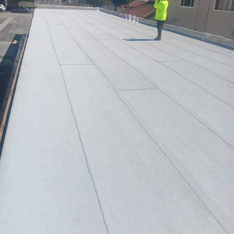 Flat roof membrane installation on garage rooftop Flat roof membrane installation on garage rooftop