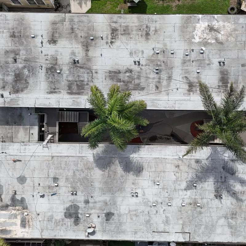 Silicone-coated flat apartment building roof with vents Silicone-coated flat apartment building roof with vents