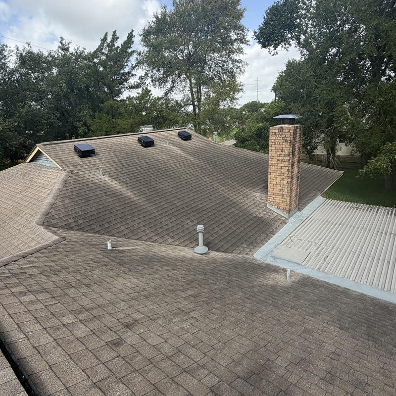 Asphalt shingle roof with vents and chimney inspection
