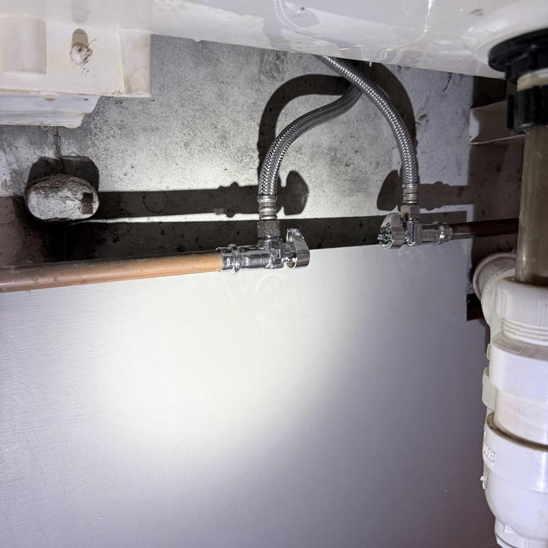Emergency stop valves on copper water lines under sink Emergency stop valves on copper water lines under sink