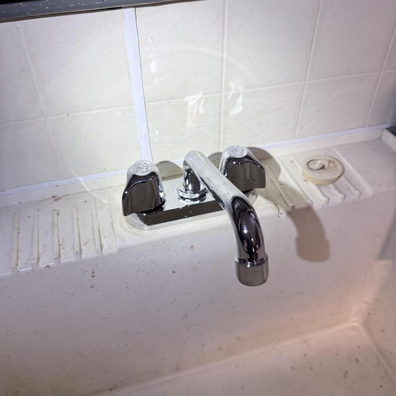 Slop sink faucet with new chrome handles Slop sink faucet with new chrome handles