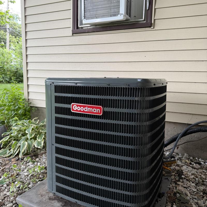 Goodman air conditioner unit installed outside home Goodman air conditioner unit installed outside home