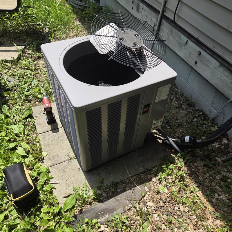 Air conditioner condenser unit with removed fan blade Air conditioner condenser unit with removed fan blade