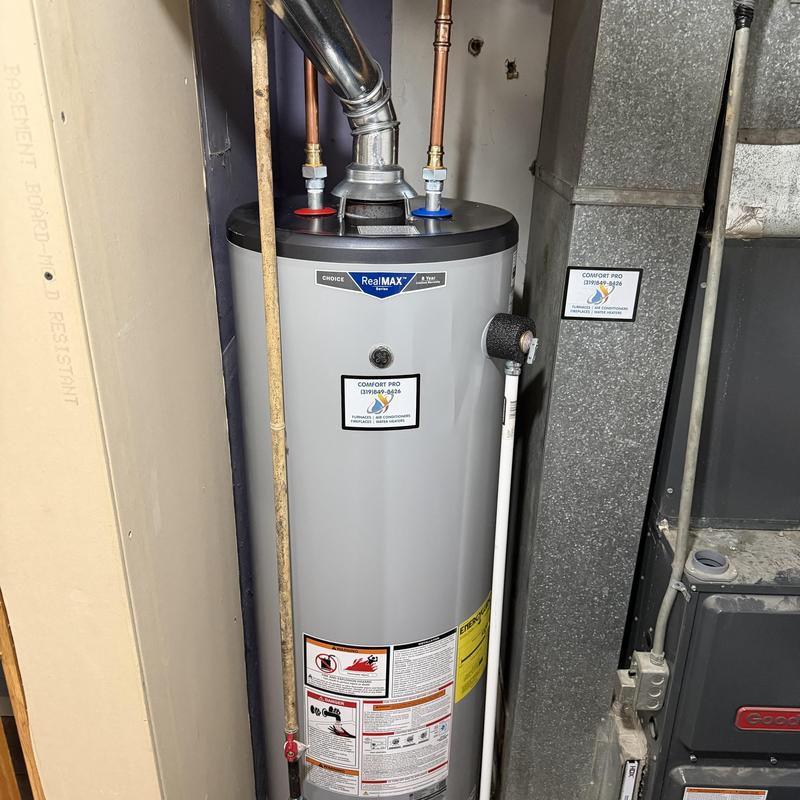 Gas water heater with vent pipe installed in basement Gas water heater with vent pipe installed in basement