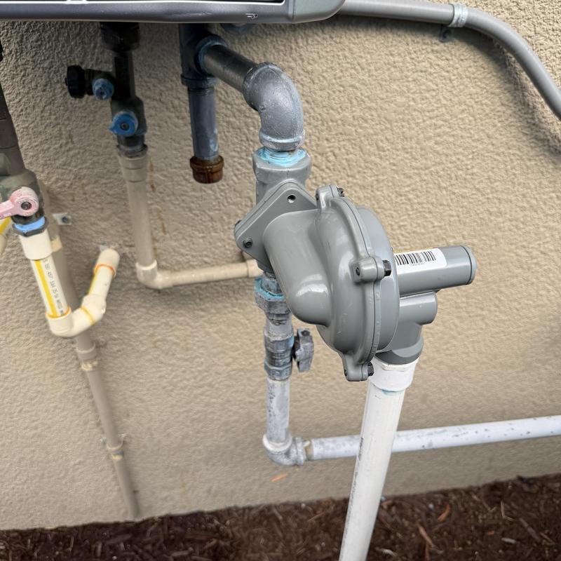 Gas regulator installation on outdoor piping system