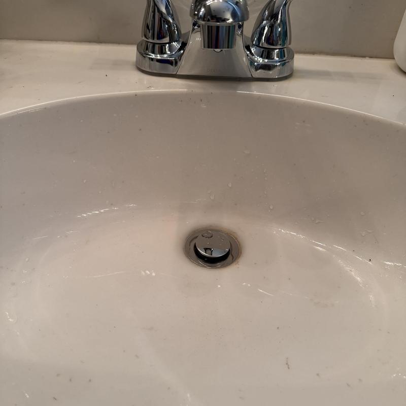 Bathroom sink faucet with new customer-supplied faucet installed