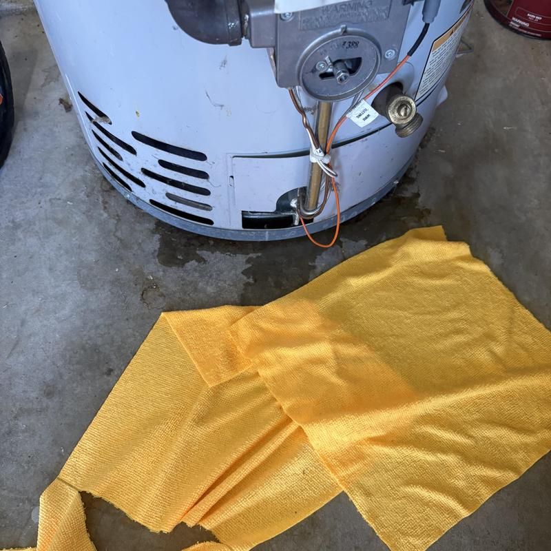 Gas water heater with water leak at base Gas water heater with water leak at base