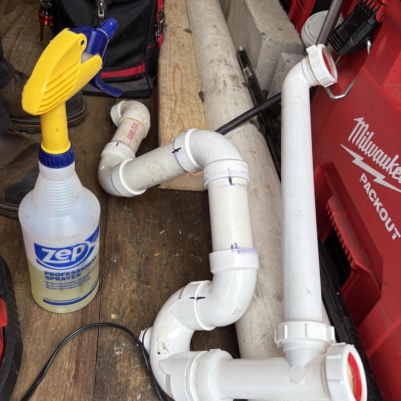 PVC sink drain system with new vent and cleanout parts PVC sink drain system with new vent and cleanout parts