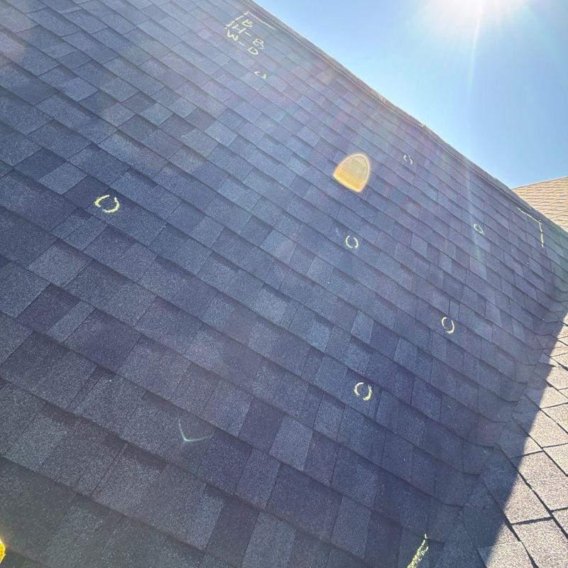 Asphalt shingle roof hail damage inspection marks