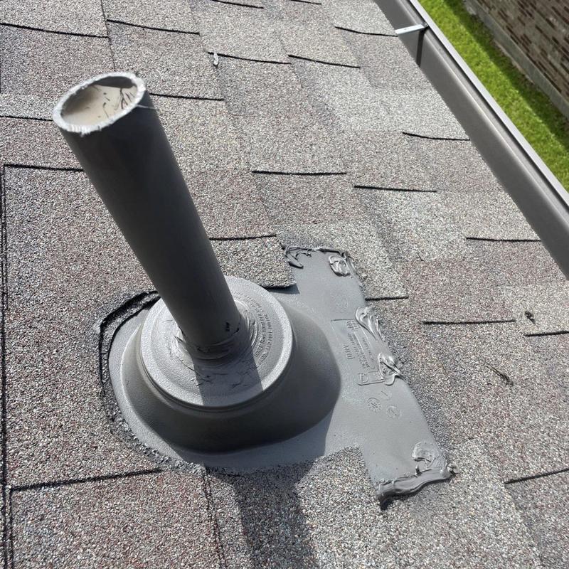 Pipe boot flashing with sealed roofing shingles