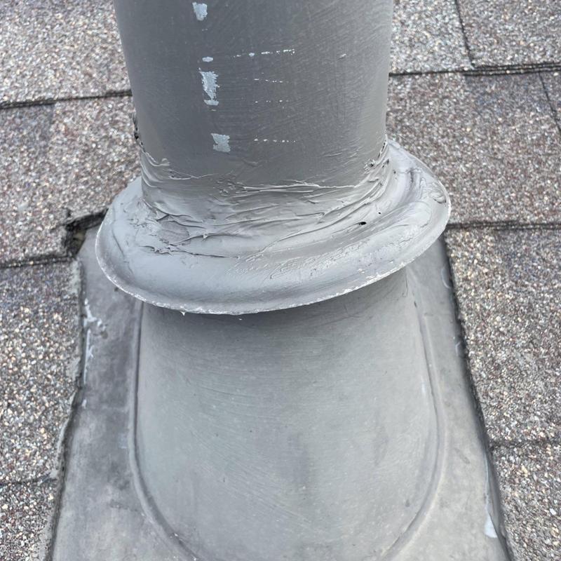 Roof pipe boot with fresh sealant on shingles