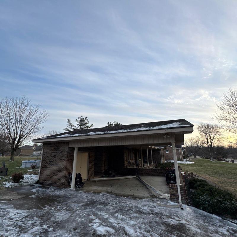 Roof shingles with hail damage and exposed components
