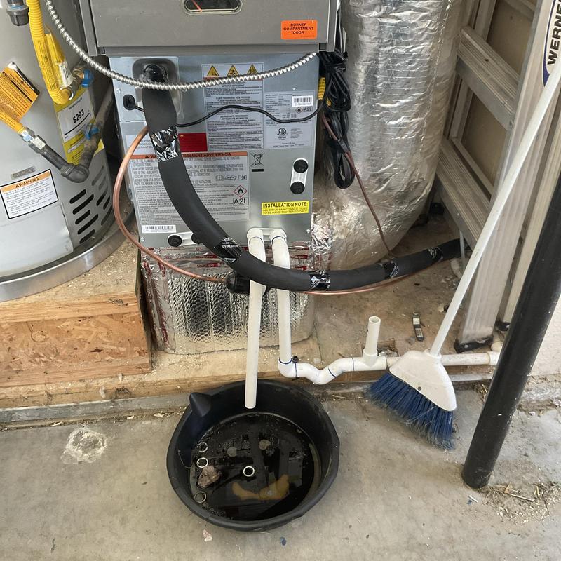 HVAC drain pipe with collected water in pan HVAC drain pipe with collected water in pan