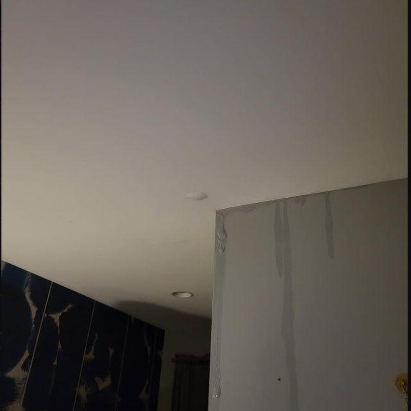 Ceiling water damage stains and drywall cracks