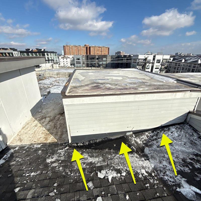 Roof flashing with hail damage and ice buildup