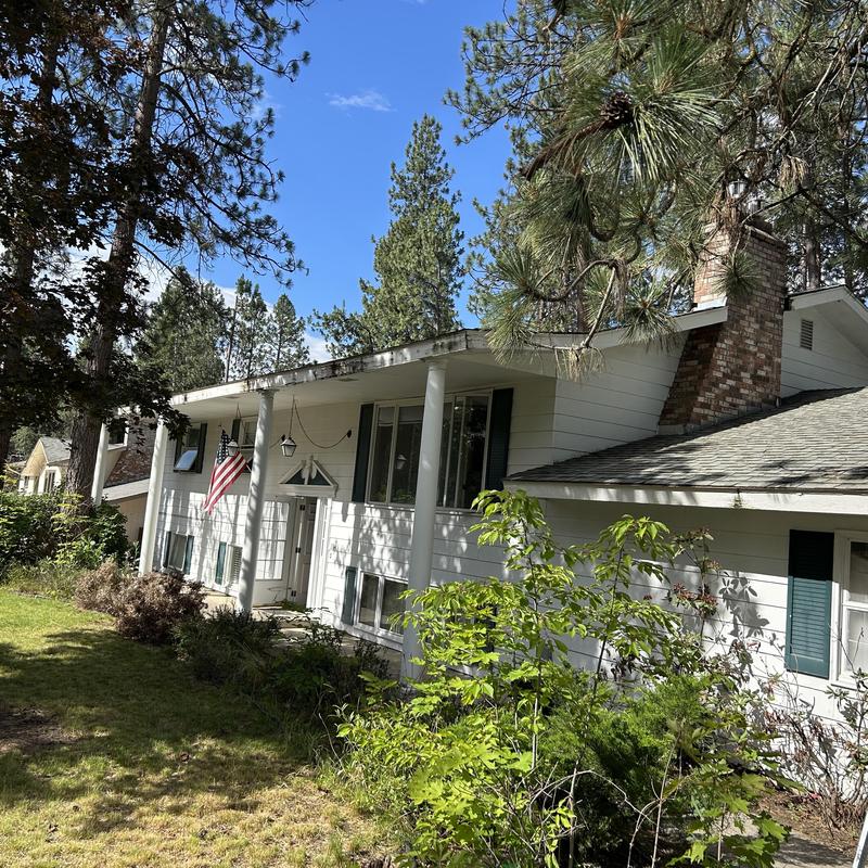 Asphalt shingle roof and chimney inspection on house exterior Asphalt shingle roof and chimney inspection on house exterior