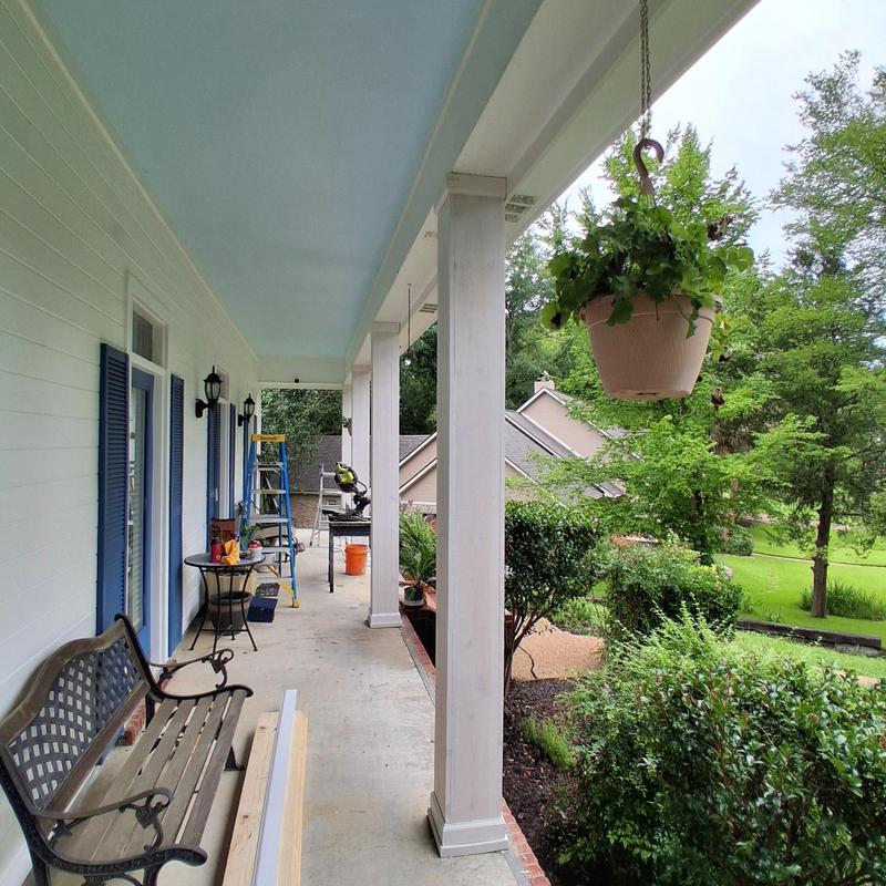 Porch columns trim and painting with ladder and tools Porch columns trim and painting with ladder and tools