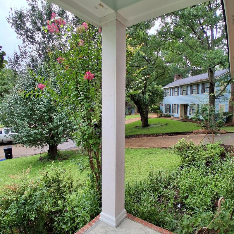 Porch column trim and paint with landscaping view Porch column trim and paint with landscaping view