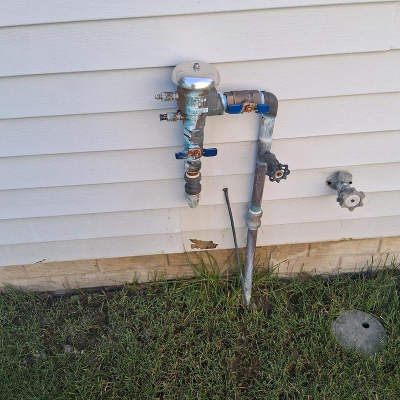 Pressure vacuum breaker assembly on exterior wall