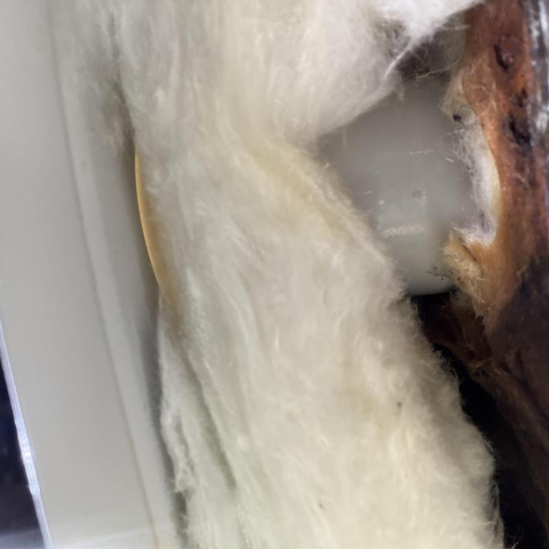 Pipe joint behind insulation showing wear damage Pipe joint behind insulation showing wear damage