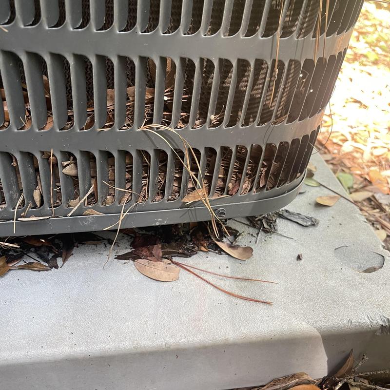 Condenser coil with debris restricting airflow outdoors