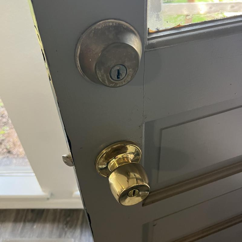 Double deadbolt and brass doorknob lock on exterior door