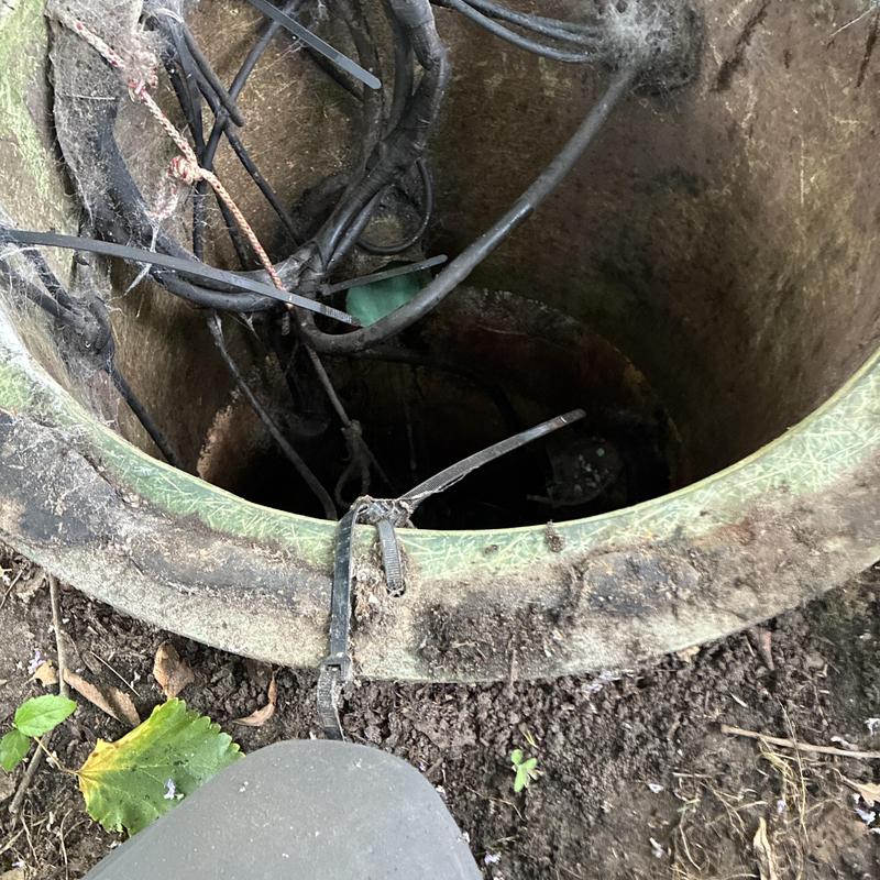 Sewer cleanout access with cables and wiring inside Sewer cleanout access with cables and wiring inside