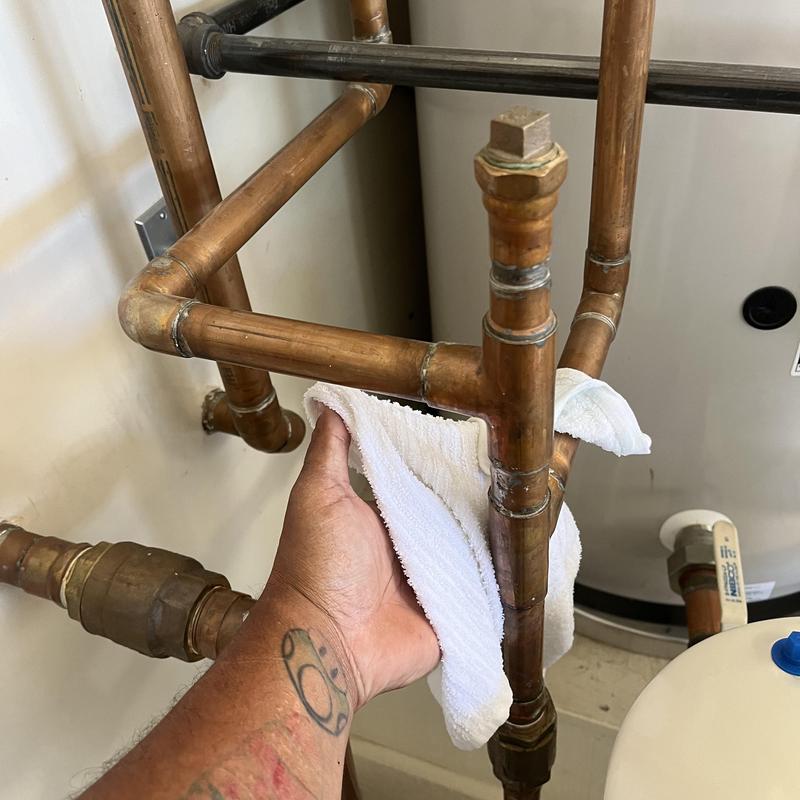 Radiant copper piping leak inspection with towel Radiant copper piping leak inspection with towel