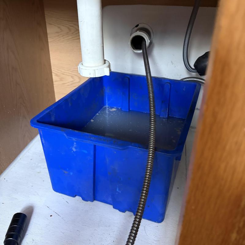 Kitchen sink drain with snake and drain container Kitchen sink drain with snake and drain container