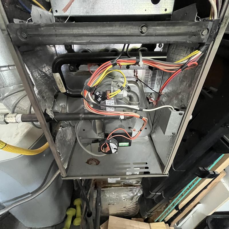 Gas furnace internal components with wiring and pipes Gas furnace internal components with wiring and pipes