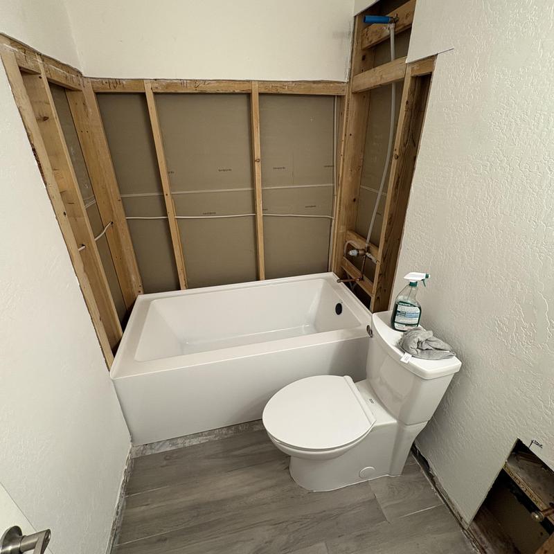 Client supplied bathtub installation with exposed framing