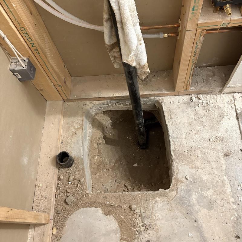 Bathroom drain pipe excavation for tub installation