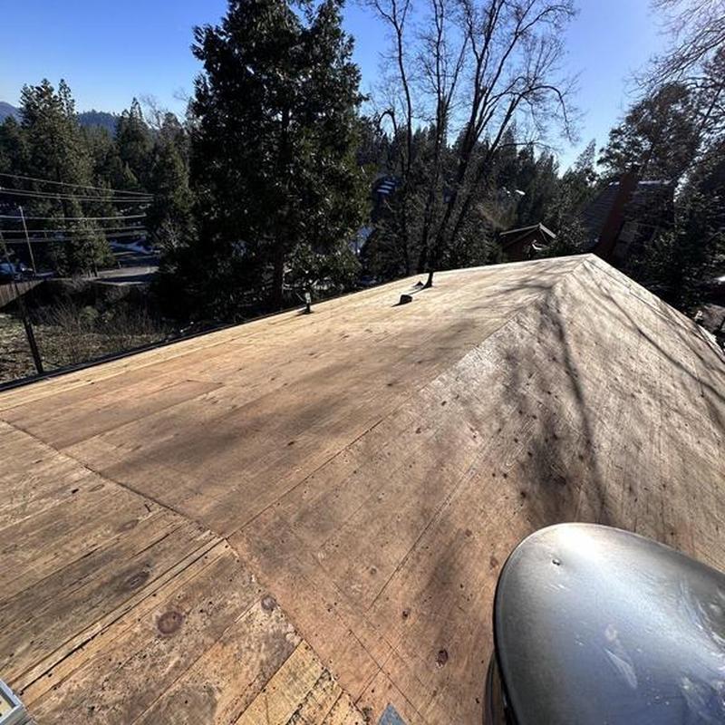 Plywood roof decking on residential cabin roof replacement