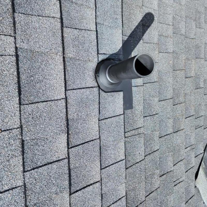 Vent pipe flashing on gray asphalt shingle roof in Sonora CA