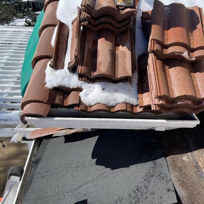 Tile roofing with snow on stack of tiles Tile roofing with snow on stack of tiles